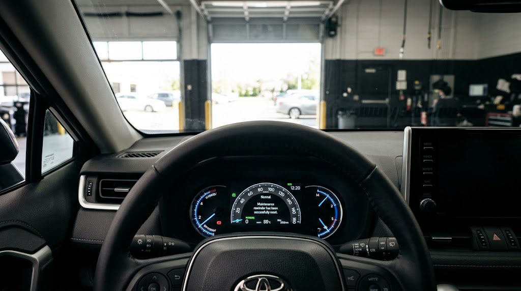 Toyota RAV4 digital instrument cluster showing successfully cleared maintenance light